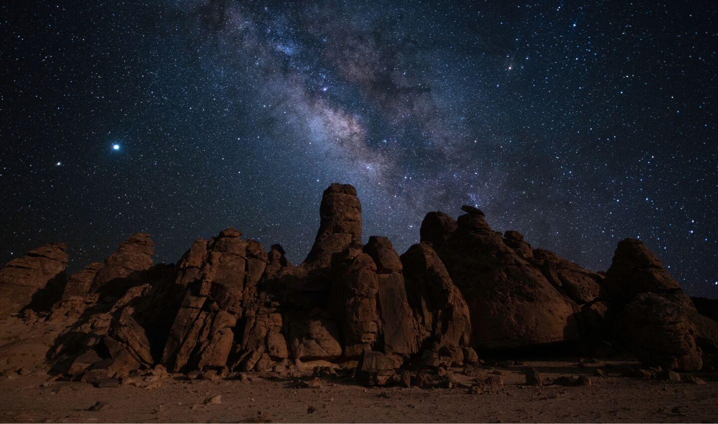 Nightscape showing the Milky Way against the red rocks of Arizona